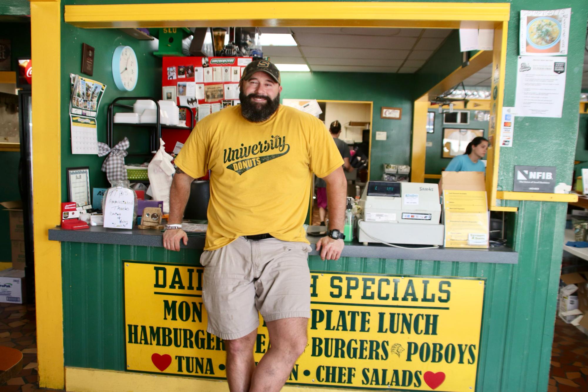 William Hall, owner of University Donuts & Diner, behind the counter
